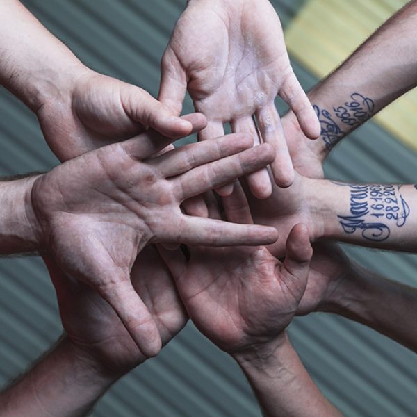 from-team-holding-hands-together